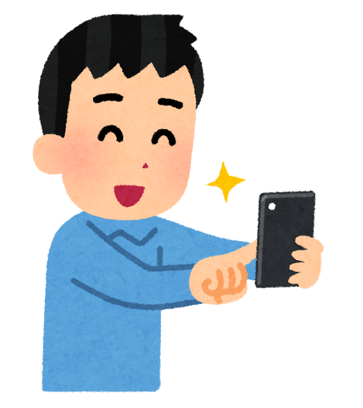 笑顔で写真を撮る男性